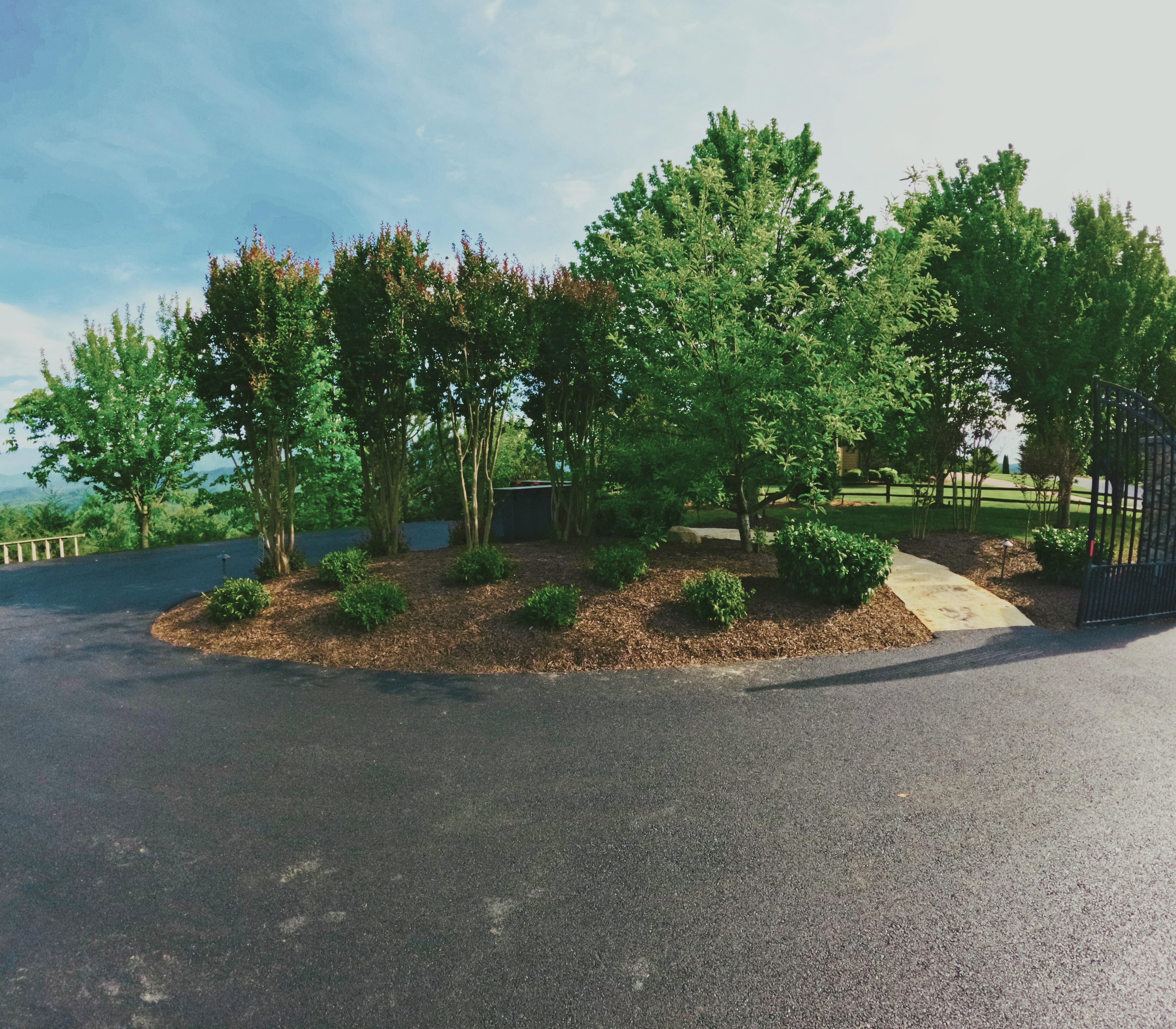 Mature landscape planting and a defined arrival edge.