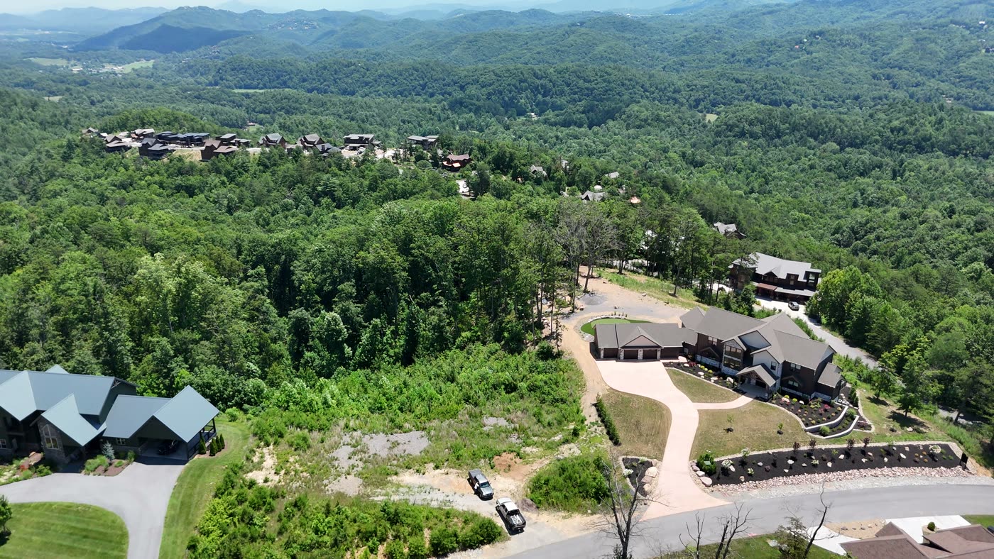 Aerial view of a completed pool and outdoor living build on an East Tennessee property